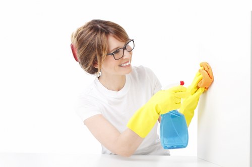 Careful cleaning of hard floors in a Pimlico residential hallway
