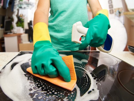Local cleaners working in a Pimlico apartment with careful attention to detail
